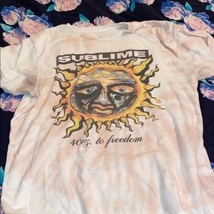 Cream colored Sublime t-shirt.